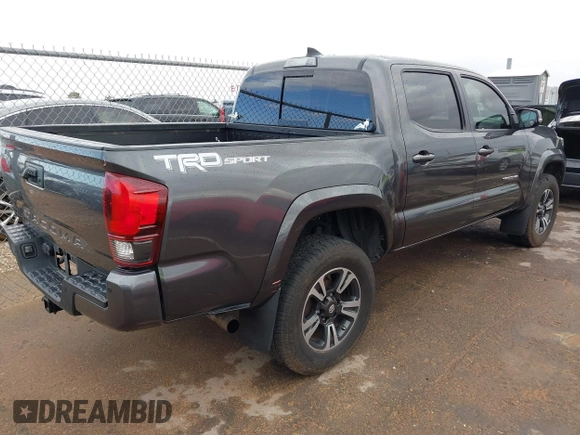 2018 Toyota Tacoma SR5 with VIN 3TMAZ5CN0JM061233, listed as a IAAI auction lot 41944668 with 94,314 mi miles and . Bid and sale history available at DreamBid. Image 4.