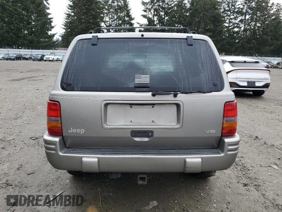 1997 Jeep Grand Cherokee Limited with VIN 1J4GZ78Y4VC693193, listed as a Copart auction lot 46327885 with 235,553 mi miles and Salvage Title. Bid and sale history available at carsss.com. Image 6.
