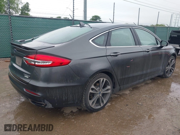 2020 Ford Fusion Titanium with VIN 3FA6P0K97LR192657, listed as a IAAI auction lot 42170258 with 87,696 mi miles and . Bid and sale history available at DreamBid. Image 4.