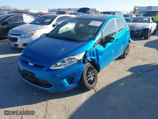 2012 Ford Fiesta SE with VIN 3FADP4EJ6CM131947, listed as a IAAI auction lot 41013636 with 148,195 mi miles. Bid and sale history available at carsss.com. Image 17.