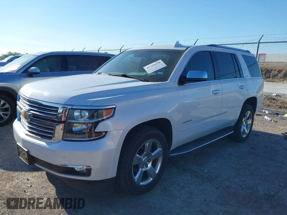 2016 Chevrolet Tahoe LTZ with VIN 1GNSKCKC0GR203348, listed as a IAAI auction lot 42220438 with 108,657 mi miles and . Bid and sale history available at DreamBid. Image 2.