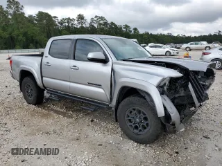 2020 Toyota Tacoma SR5 with VIN 5TFAZ5CNXLX095175, listed as a Copart auction lot 54339355 with 61,187 mi miles and Salvage title. Bid and sale history available at DreamBid. Image 4.