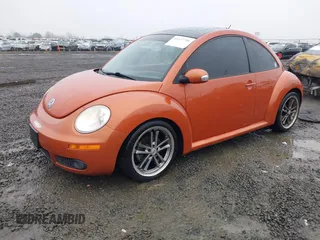 2010 Volkswagen New Beetle Coupe with VIN 3VWRG3AG3AM024689, listed as a IAAI auction lot 41037756 with 102,180 mi miles. Bid and sale history available at carsss.com. Image 2.