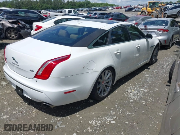 2015 Jaguar XJ with VIN SAJWA1CZ0F8V75119, listed as a IAAI auction lot 42248663 with 94,060 mi miles and . Bid and sale history available at DreamBid. Image 4.