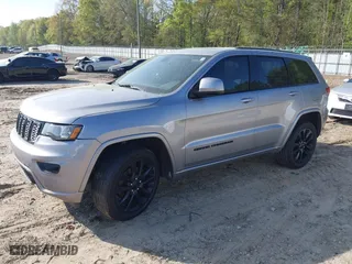 2018 Jeep Grand Cherokee Laredo E with VIN 1C4RJFAG0JC284927, listed as a IAAI auction lot 41964013 with 130,145 mi miles. Bid and sale history available at carsss.com. Image 2.