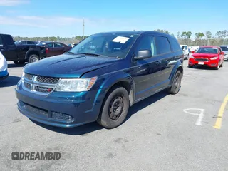 2014 Dodge Journey American Value Pkg with VIN 3C4PDCAB4ET103534, listed as a IAAI auction lot 41805531 with 175,310 mi miles. Bid and sale history available at carsss.com. Image 2.