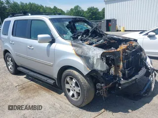 2010 Honda Pilot Touring z VIN 5FNYF4H94AB010058, wystawiony jako IAAI lot #42495313 z przebiegiem 157 306 mil mil oraz . Historia ofert i sprzedaży dostępna na DreamBid. Obrazek 1.