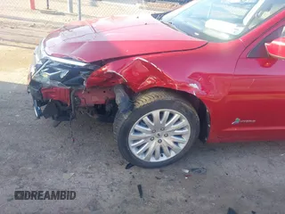 2011 Ford Fusion Hybrid with VIN 3FADP0L3XBR342051, listed as a IAAI auction lot 41880330 with 118,776 mi miles and . Bid and sale history available at DreamBid. Image 6.