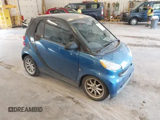 2009 Smart fortwo Pure with VIN WMEEJ31X89K228315, listed as a IAAI auction lot 42662931 with 60,666 mi miles and . Bid and sale history available at DreamBid. Image 1.