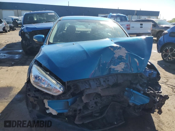 2017 Ford Focus SE with VIN 1FADP3F23HL203794, listed as a Copart auction lot 57202435 with 116,824 mi miles and Salvage title. Bid and sale history available at DreamBid. Image 5.