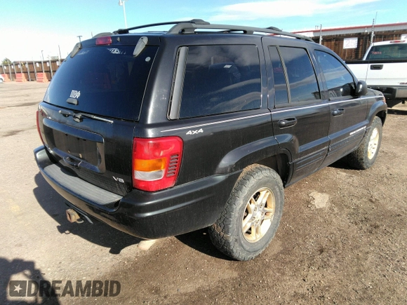 1999 Jeep Grand Cherokee Limited with VIN 1J4GW68N8XC770305, listed as a IAAI auction lot 41720558 with 206,180 mi miles. Bid and sale history available at carsss.com. Image 4.