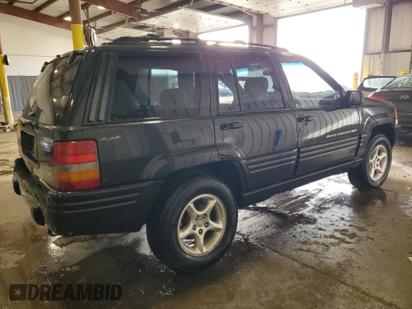 1998 Jeep Grand Cherokee Limited z VIN 1J4GZ88Z0WC276394, wystawiony jako Copart lot #46702355 z przebiegiem 144 232 mil mil oraz Szkoda całkowita • Salvage title. Historia ofert i sprzedaży dostępna na DreamBid. Obrazek 3.