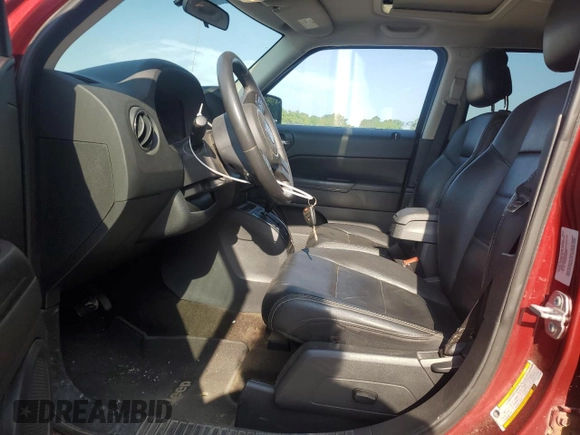 2015 Jeep Patriot High Altitude with VIN 1C4NJRFBXFD272296, listed as a Copart auction lot 62051095 with 118,496 mi miles and Salvage title. Bid and sale history available at DreamBid. Image 7.