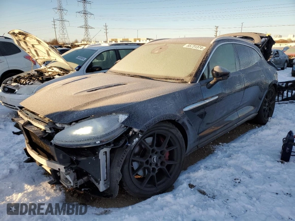 2021 Aston Martin DBX z VIN SCFVUJAW9MTV02708, wystawiony jako Copart lot #85731374 z przebiegiem Nie podano mil oraz Szkoda całkowita • Salvage title. Historia ofert i sprzedaży dostępna na DreamBid. Obrazek 1.