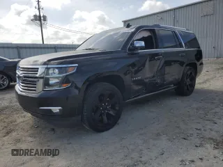 2016 Chevrolet Tahoe LTZ with VIN 1GNSCCKC7GR129326, listed as a Copart auction lot 59909015 with 133,542 mi miles and Salvage title. Bid and sale history available at DreamBid. Image 1.