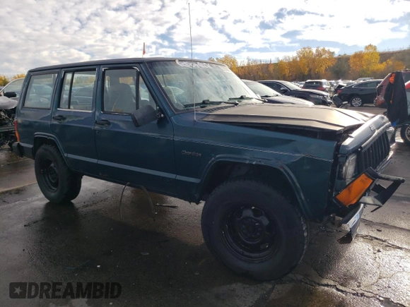 1996 Jeep Cherokee SE z VIN 1J4FJ28S6TL184205, wystawiony jako Copart lot #77558034 z przebiegiem 195 000 mil mil oraz Tytuł czysty. Historia ofert i sprzedaży dostępna na DreamBid. Obrazek 4.