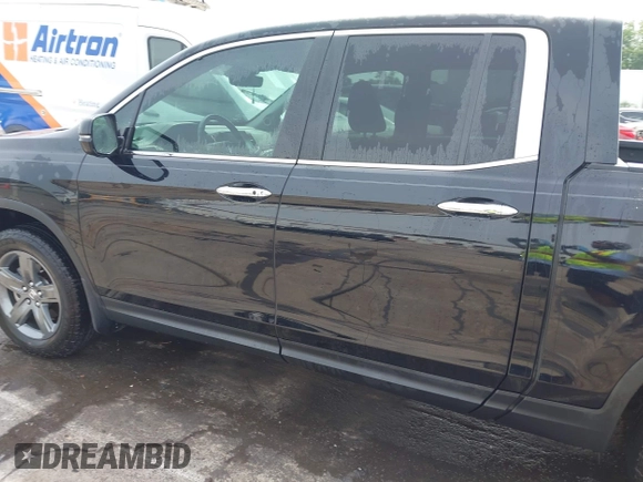 2023 Honda Ridgeline RTL-E with VIN 5FPYK3F76PB042100, listed as a IAAI auction lot 42274861 with 16,822 mi miles and . Bid and sale history available at DreamBid. Image 14.