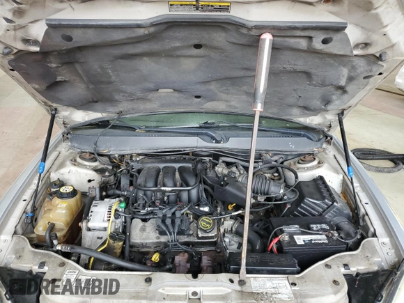 2005 Ford Taurus SE with VIN 1FAFP53215A133518, listed as a Copart auction lot 59615205 with 127,778 mi miles and Salvage title. Bid and sale history available at DreamBid. Image 11.