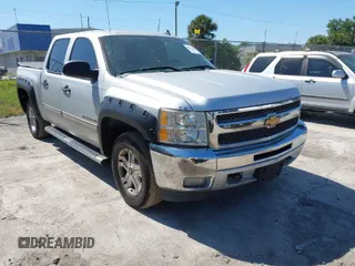 2013 Chevrolet Silverado 1500 LT with VIN 3GCPKSE71DG203443, listed as a IAAI auction lot 42033447 with 128,904 mi miles. Bid and sale history available at carsss.com. Image 1.