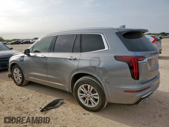 2024 Cadillac XT6 FWD Luxury with VIN 1GYKPAR41RZ700452, listed as a Copart auction lot 57675945 with 27,449 mi miles and Salvage title. Bid and sale history available at DreamBid. Image 2.