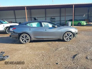 2016 Nissan Maxima SV z VIN 1N4AA6APXGC386974, wystawiony jako IAAI lot #41738932 z przebiegiem 132 395 mil mil oraz . Historia ofert i sprzedaży dostępna na DreamBid. Obrazek 14.