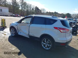 2014 Ford Escape Titanium with VIN 1FMCU9JX7EUD17335, listed as a IAAI auction lot 41302107 with 104,352 mi miles and . Bid and sale history available at DreamBid. Image 3.