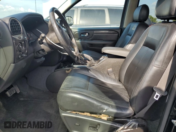 2006 GMC Envoy SLE z VIN 1GKDS13S062176000, wystawiony jako Copart lot #57672995 z przebiegiem 161 455 mil mil oraz Szkoda całkowita • Salvage title. Historia ofert i sprzedaży dostępna na DreamBid. Obrazek 7.