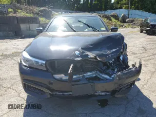 2017 BMW 7 Series 740i xDrive with VIN WBA7E4C54HGU99710, listed as a Copart auction lot 69572544 with 0 mi miles and Salvage Title. Bid and sale history available at carsss.com. Image 5.