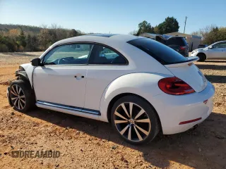 2012 Volkswagen Beetle 2.0T Turbo w/Sun/Snd/Nav PZEV with VIN 3VWVA7AT9CM656846, listed as a Copart auction lot 49466825 with 76,362 mi miles and Salvage Title. Bid and sale history available at carsss.com. Image 2.