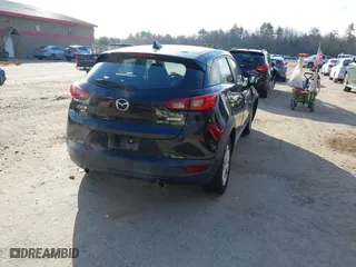 2016 Mazda CX-3 Sport with VIN JM1DKBB75G0124907, listed as a IAAI auction lot 42107232 with 128,411 mi miles. Bid and sale history available at carsss.com. Image 4.