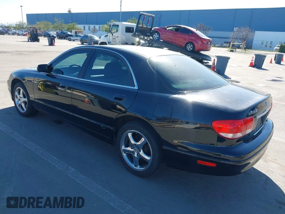 2002 Mazda Millenia S z VIN JM1TA222421728535, wystawiony jako IAAI lot #41525259 z przebiegiem 131 870 mil mil oraz . Historia ofert i sprzedaży dostępna na DreamBid. Obrazek 3.