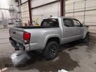2023 Toyota Tacoma SR with VIN 3TMCZ5AN9PM604793, listed as a IAAI auction lot 42251347 with 39,741 mi miles and . Bid and sale history available at DreamBid. Image 4.