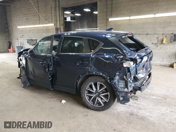 2018 Mazda CX-5 Touring z VIN JM3KFBCM3J0464815, wystawiony jako Copart lot #58794685 z przebiegiem Nie podano mil oraz Szkoda całkowita • Salvage title. Historia ofert i sprzedaży dostępna na DreamBid. Obrazek 2.
