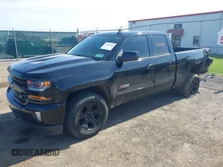 2017 Chevrolet Silverado 1500 LT with VIN 1GCVKREC6HZ271160, listed as a IAAI auction lot 42162389 with 103,992 mi miles and . Bid and sale history available at DreamBid. Image 2.