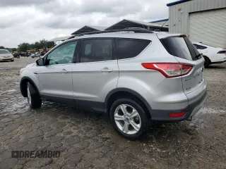 2013 Ford Escape SE with VIN 1FMCU0GX7DUA57262, listed as a Copart auction lot 59088705 with 157,201 mi miles and Salvage title. Bid and sale history available at DreamBid. Image 2.