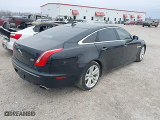 2015 Jaguar XJ with VIN SAJWJ2GD0F8V85914, listed as a IAAI auction lot 41615059 with 115,462 mi miles. Bid and sale history available at carsss.com. Image 4.