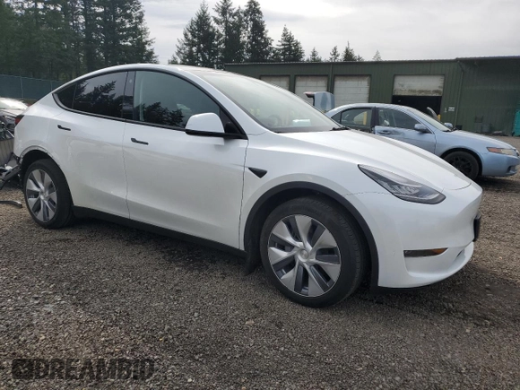 2023 Tesla Model Y Long Range with VIN 7SAYGDEE6PA101291, listed as a Copart auction lot 52758115 with 7,250 mi miles and Salvage Title. Bid and sale history available at DreamBid. Image 4.
