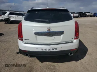 2014 Cadillac SRX Premium Collection z VIN 3GYFNGE32ES573872, wystawiony jako Copart lot #49871955 z przebiegiem 119 362 mil mil oraz Szkody całkowita. Historia ofert i sprzedaży dostępna na DreamBid. Obrazek 6.