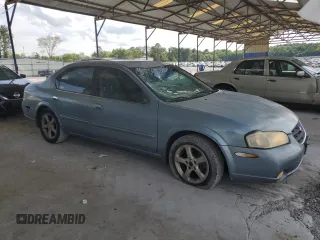 2000 Nissan Maxima GXE with VIN JN1CA31A1YT223132, listed as a Copart auction lot 60148655 with 269,258 mi miles and Salvage title. Bid and sale history available at DreamBid. Image 4.