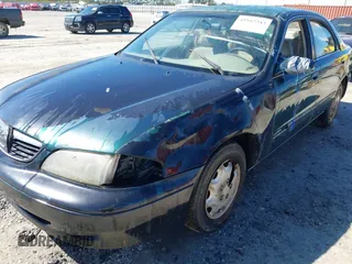 1999 Mazda 626 ES with VIN 1YVGF22C2X5859646, listed as a IAAI auction lot 41887343 with 1 mi miles. Bid and sale history available at carsss.com. Image 6.
