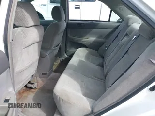 2002 Toyota Camry XLE z VIN 4T1BF30KX2U035422, wystawiony jako IAAI lot #41762363 z przebiegiem 220 465 mil mil oraz . Historia ofert i sprzedaży dostępna na DreamBid. Obrazek 8.