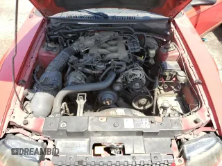 2002 Ford Mustang Deluxe z VIN 1FAFP44472F107630, wystawiony jako Copart lot #56256865 z przebiegiem 214 457 mil mil oraz Szkoda całkowita • Salvage title. Historia ofert i sprzedaży dostępna na DreamBid. Obrazek 11.