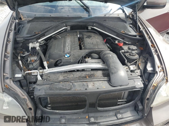 2012 BMW X5 35i with VIN 5UXZV4C51CL748765, listed as a Copart auction lot 62339905 with Not provided miles and Clean title. Bid and sale history available at DreamBid. Image 12.