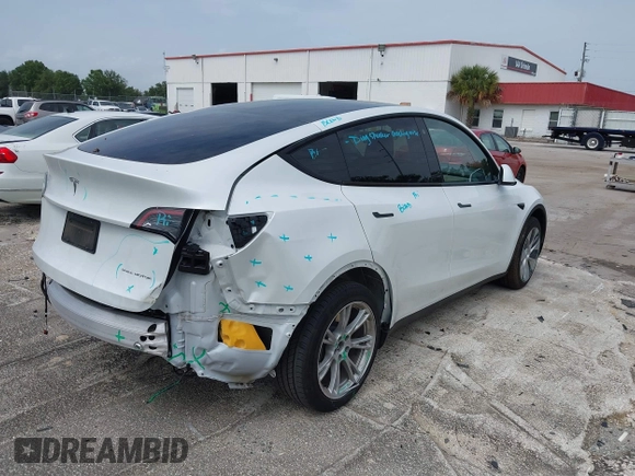 2023 Tesla Model Y Long Range z VIN 7SAYGDEE0PA065534, wystawiony jako IAAI lot #42445868 z przebiegiem 22 638 mil mil oraz . Historia ofert i sprzedaży dostępna na DreamBid. Obrazek 4.