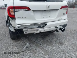 2020 Honda Pilot Touring 8-Passenger with VIN 5FNYF6H96LB056229, listed as a IAAI auction lot 41738249 with 65,099 mi miles and . Bid and sale history available at DreamBid. Image 21.