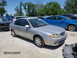 2004 Kia Spectra GS with VIN KNAFB161945141309, listed as a Copart auction lot 52395445 with 99,100 mi miles and Clean Title. Bid and sale history available at DreamBid. Image 4.
