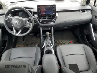 2022 Toyota Corolla Cross XLE with VIN 7MUDAABG6NV006829, listed as a Copart auction lot 55626965 with 23,187 mi miles and Salvage title. Bid and sale history available at DreamBid. Image 8.