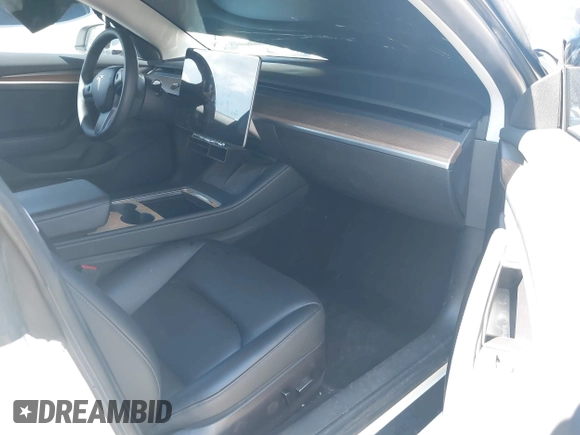 2023 Tesla Model 3 z VIN 5YJ3E1EA3PF451392, wystawiony jako IAAI lot #41668299 z przebiegiem 77 915 mil mil oraz . Historia ofert i sprzedaży dostępna na DreamBid. Obrazek 5.