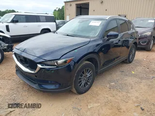 2020 Mazda CX-5 Touring with VIN JM3KFBCM9L0741535, listed as a IAAI auction lot 42101763 with 54,004 mi miles and . Bid and sale history available at DreamBid. Image 2.