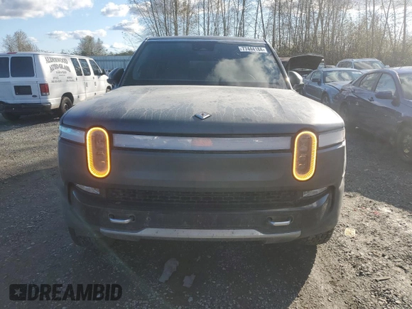 2022 Rivian R1S Launch Edition with VIN 7PDSGABL1NN000514, listed as a Copart auction lot 77444184 with 29,490 mi miles and Salvage Title. Bid and sale history available at DreamBid. Image 5.